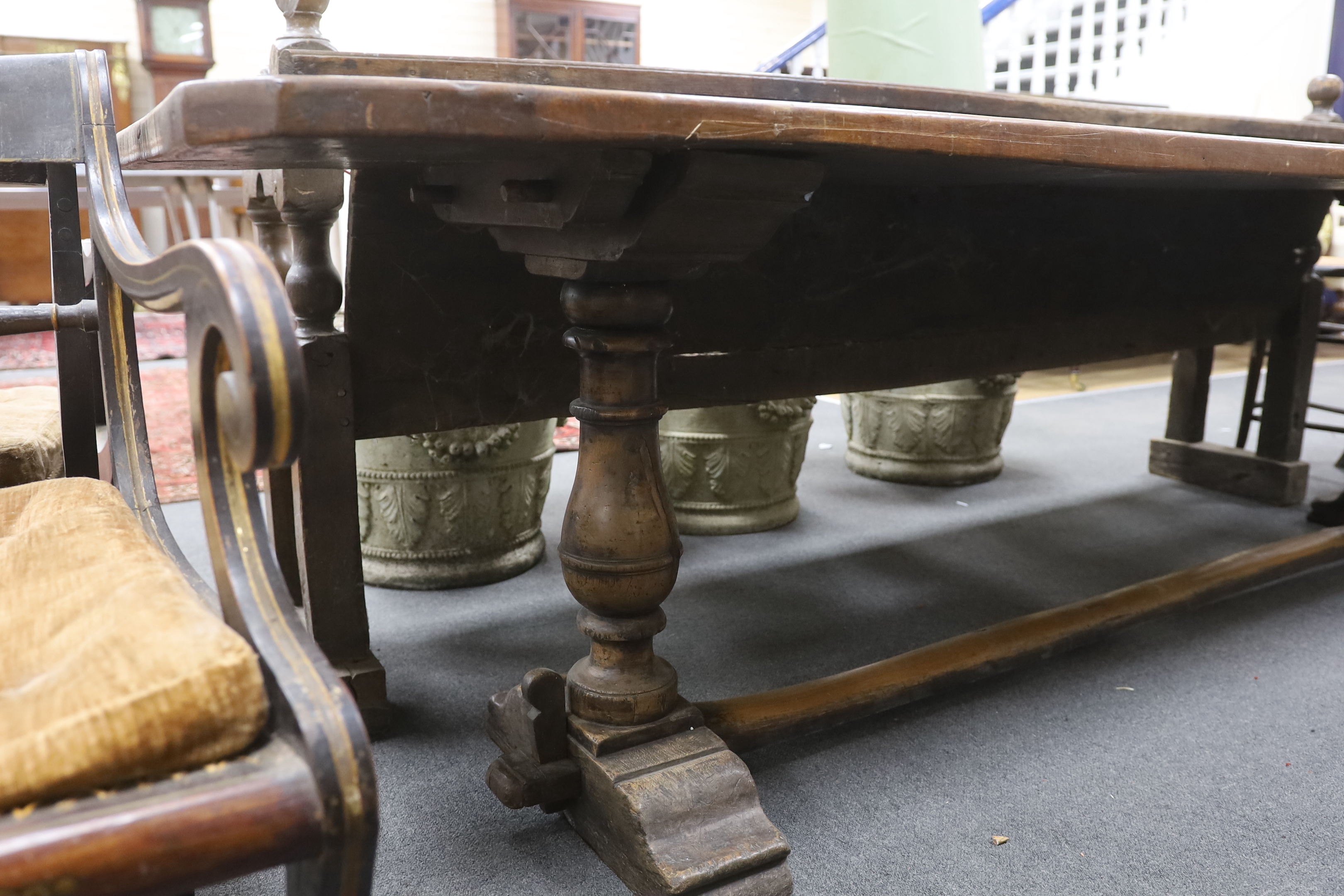 An 18th century style walnut refectory table, width 270cm, depth 59cm, height 74cm, Provenance- Brede Place, East Sussex, a former residence of the Frewen family from 1712-1936.